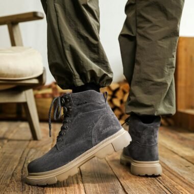 Fashionable boots with casual pants in a cozy indoor setting.
